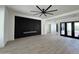 Open-concept living room with a modern fireplace and sleek design elements at 5088 S Ponderosa Dr, Gilbert, AZ 85298