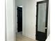 Modern kitchen features a door to pantry with a window and the word Pantry written on it, next to another black door at 5088 S Ponderosa Dr, Gilbert, AZ 85298
