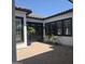 Cozy courtyard featuring black trimmed windows, a modern style and stylish landscaping at 5088 S Ponderosa Dr, Gilbert, AZ 85298
