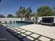 Lush backyard showcasing the refreshing pool and an outdoor fireplace, an entertainer's dream at 5088 S Ponderosa Dr, Gilbert, AZ 85298