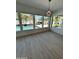 Bright sunroom featuring large windows overlooking a beautiful pool and backyard at 5088 S Ponderosa Dr, Gilbert, AZ 85298