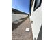 A practical side yard with gravel and stepping stones, providing utility and low-maintenance landscaping at 5088 S Ponderosa Dr, Gilbert, AZ 85298