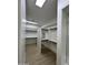 Spacious walk-in closet with custom shelving and modern lighting at 5088 S Ponderosa Dr, Gilbert, AZ 85298