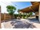 Spacious covered back patio with a lush backyard and privacy fence at 518 N Cheri Lynn Dr, Chandler, AZ 85225