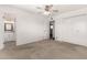 Neutral bedroom with carpet and a ceiling fan, plus ensuite bathroom and a large closet at 518 N Cheri Lynn Dr, Chandler, AZ 85225