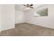 Light and airy bedroom featuring a ceiling fan and a view of the outdoors at 518 N Cheri Lynn Dr, Chandler, AZ 85225