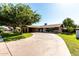 Single-story home with a spacious driveway and mature trees at 518 N Cheri Lynn Dr, Chandler, AZ 85225