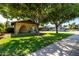 Charming single-story home with mature trees and a well-maintained lawn at 518 N Cheri Lynn Dr, Chandler, AZ 85225