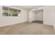A living room with neutral carpet and a large window at 518 N Cheri Lynn Dr, Chandler, AZ 85225