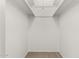 Bright walk-in closet with ample storage space and neutral carpet at 518 N Cheri Lynn Dr, Chandler, AZ 85225