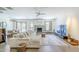Bright and airy living room with a modern fireplace, a dining area, and a polished concrete floor at 5239 E Waltann Ln, Scottsdale, AZ 85254
