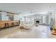 Open-concept living room features polished concrete floors, a modern fireplace, and a breakfast bar at 5239 E Waltann Ln, Scottsdale, AZ 85254