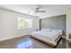 Well-lit main bedroom with a large window and a modern ceiling fan at 5239 E Waltann Ln, Scottsdale, AZ 85254