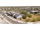 Aerial view of a neighborhood, highlighting desert landscaping, modern architecture, and a community pool at 5954 E Cat Balue Dr, Phoenix, AZ 85054