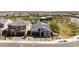 Aerial view of a single-Gathering home with desert landscaping, a grey roof, and a three-car garage at 5954 E Cat Balue Dr, Phoenix, AZ 85054