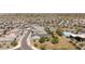 An aerial shot showcases the community's layout, landscaping, pool and clubhouse near residential properties at 5954 E Cat Balue Dr, Phoenix, AZ 85054