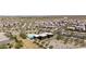 An aerial view of a meticulously designed community with a pool, clubhouse, and beautiful landscaping at 5954 E Cat Balue Dr, Phoenix, AZ 85054