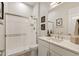 Modern bathroom with glass-enclosed shower, sleek fixtures, and an elegant quartz countertop at 5954 E Cat Balue Dr, Phoenix, AZ 85054