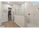 A view of the walk-in shower and walk-in closet in the primary bath at 5954 E Cat Balue Dr, Phoenix, AZ 85054