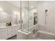Primary bath offers a dual sink vanity, glass enclosed shower, and walk-in closet at 5954 E Cat Balue Dr, Phoenix, AZ 85054