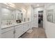 Stylish bathroom featuring double sinks, and walk-in closet at 5954 E Cat Balue Dr, Phoenix, AZ 85054