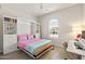 Bedroom offers a Murphy bed, desk, and a window with natural light; versatile and stylish at 5954 E Cat Balue Dr, Phoenix, AZ 85054