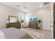Well-lit Primary bedroom with wood-look flooring and TV with a view at 5954 E Cat Balue Dr, Phoenix, AZ 85054
