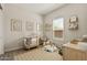 Delightful Bedroom with soft hues, playful décor, and abundant natural light at 5954 E Cat Balue Dr, Phoenix, AZ 85054