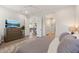 Bright primary bedroom boasts ensuite bath and is connected to other rooms at 5954 E Cat Balue Dr, Phoenix, AZ 85054