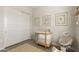 Bright Bedroom features wood floors, a crib, rocking chair, and Winnie the Pooh themed decorations at 5954 E Cat Balue Dr, Phoenix, AZ 85054