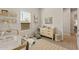Well-lit Bedroom featuring essential baby furniture, plenty of space for growth and play at 5954 E Cat Balue Dr, Phoenix, AZ 85054
