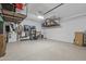 Garage featuring epoxy flooring, storage racks, and ample room for vehicles or hobbies at 5954 E Cat Balue Dr, Phoenix, AZ 85054