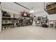 Large garage featuring epoxy flooring, installed storage, and ample space at 5954 E Cat Balue Dr, Phoenix, AZ 85054