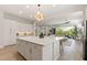 Open kitchen featuring a large island, stainless steel appliances, and views of the living area at 5954 E Cat Balue Dr, Phoenix, AZ 85054