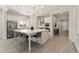 Bright modern kitchen with a large island, stainless steel appliances, and light wood-look floors at 5954 E Cat Balue Dr, Phoenix, AZ 85054