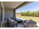 Serene covered patio with backyard views, offering a comfortable and relaxing outdoor space at 5954 E Cat Balue Dr, Phoenix, AZ 85054