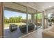 An outdoor patio with seating area is visible through sliding glass doors at 5954 E Cat Balue Dr, Phoenix, AZ 85054