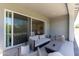 Stylish covered patio with an open sliding glass door to a lovely view inside the home at 5954 E Cat Balue Dr, Phoenix, AZ 85054