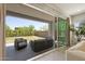Covered patio with ample seating overlooks a nicely landscaped backyard at 5954 E Cat Balue Dr, Phoenix, AZ 85054
