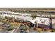 Aerial view of a shopping center with unique architecture, palm trees, and ample parking at 5954 E Cat Balue Dr, Phoenix, AZ 85054