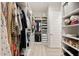 Well-organized walk-in closet offers extensive shelving and storage solutions, designed for optimal use at 5954 E Cat Balue Dr, Phoenix, AZ 85054