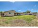 Spacious backyard with a covered patio and green grass, great for outdoor entertaining and relaxation at 624 N Ashbrook Cir, Mesa, AZ 85213