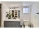 Updated bathroom with a modern vanity, subway tile shower, and stylish fixtures at 624 N Ashbrook Cir, Mesa, AZ 85213