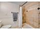 Shower featuring tan tiling, a shower curtain, and black hardware at 624 N Ashbrook Cir, Mesa, AZ 85213