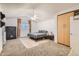 Neutral bedroom with ceiling fan, closet space, and a window offering natural light at 624 N Ashbrook Cir, Mesa, AZ 85213