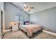 Bedroom showcasing a bed with a pink blanket, a ceiling fan and neutral carpeting at 624 N Ashbrook Cir, Mesa, AZ 85213