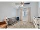 Cozy Bedroom with a grey crib, neutral carpet, and natural light from a window at 624 N Ashbrook Cir, Mesa, AZ 85213