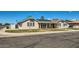 Street view of cozy home with solar panels, clean landscaping, and easy street access at 624 N Ashbrook Cir, Mesa, AZ 85213