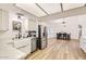 Modern kitchen features stainless steel appliances, a farmhouse sink, and an open layout to the dining area at 624 N Ashbrook Cir, Mesa, AZ 85213