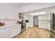 Modern kitchen features white cabinets, stainless steel appliances, and bright lighting at 624 N Ashbrook Cir, Mesa, AZ 85213